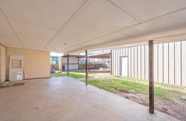 view of patio with a storage unit