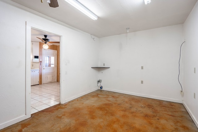 laundry area featuring ceiling fan and light colored carpet