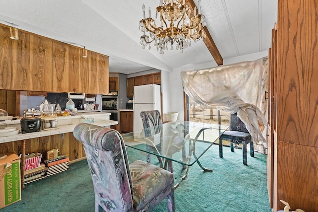 carpeted dining space with lofted ceiling with beams, a textured ceiling, and an inviting chandelier