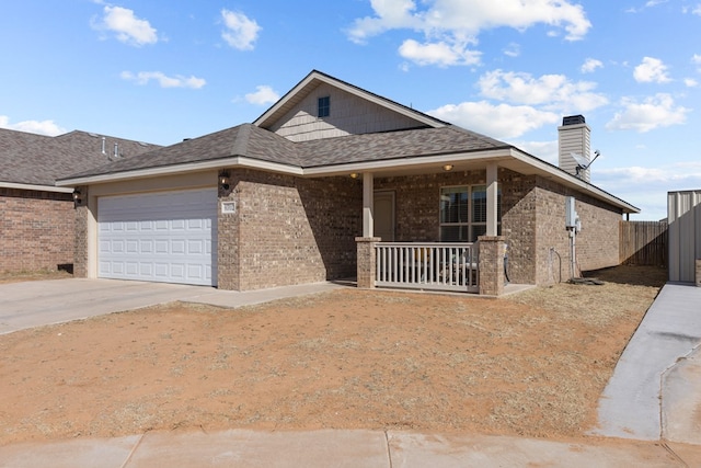 view of front of home featuring a porch and a garage