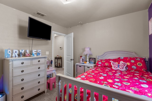 bedroom featuring light carpet