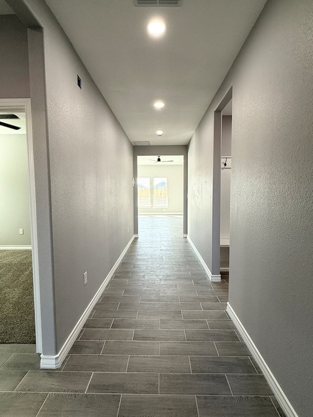 corridor with dark wood-type flooring