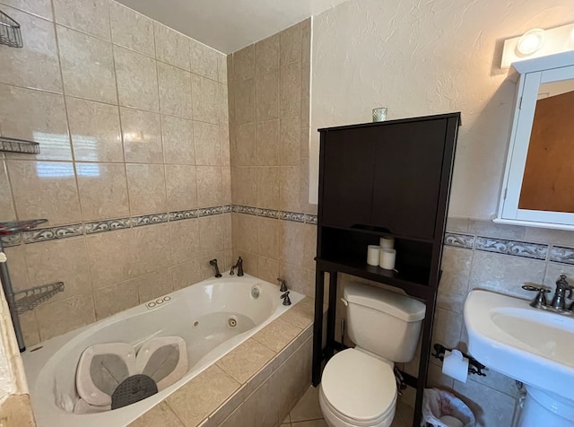 bathroom with a relaxing tiled tub, toilet, and tile walls