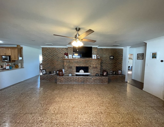 unfurnished living room featuring a fireplace, ceiling fan, crown molding, and a textured ceiling