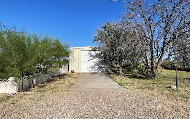 view of front of house with a garage and an outdoor structure