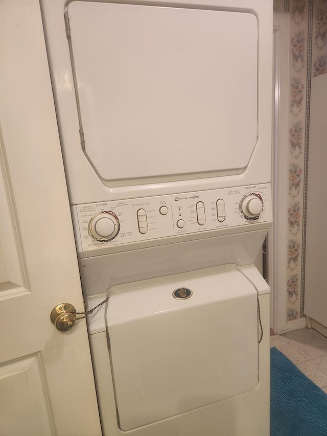 laundry room featuring stacked washer / dryer