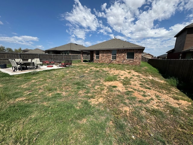 view of yard featuring a patio area and a fire pit