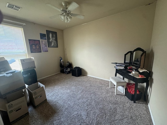 miscellaneous room featuring ceiling fan and carpet