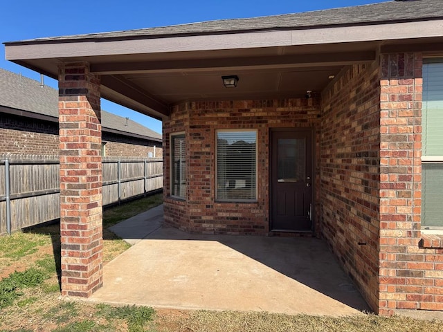 entrance to property featuring a patio