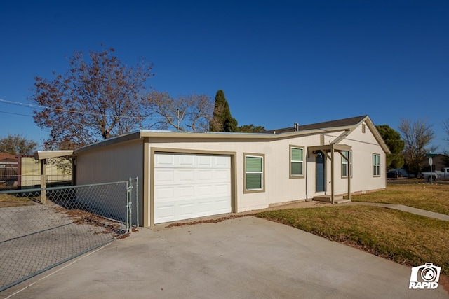 single story home featuring a garage and a front yard