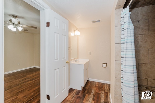 bathroom with ceiling fan, hardwood / wood-style floors, vanity, and a shower with shower curtain