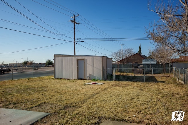 view of outbuilding featuring a lawn