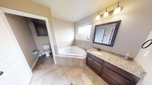 full bath featuring baseboards, toilet, a bath, and vanity