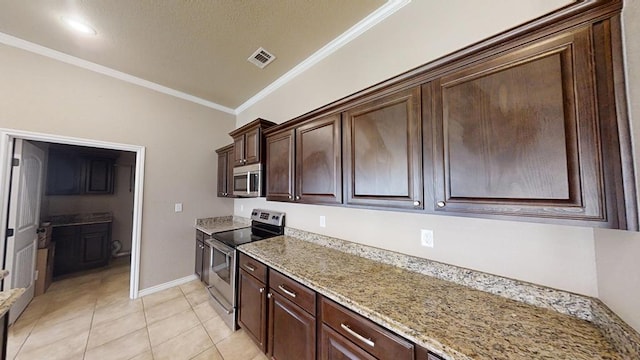 kitchen with light tile patterned floors, visible vents, appliances with stainless steel finishes, and ornamental molding