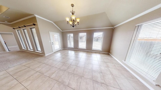 foyer entrance with an inviting chandelier, a barn door, crown molding, and vaulted ceiling