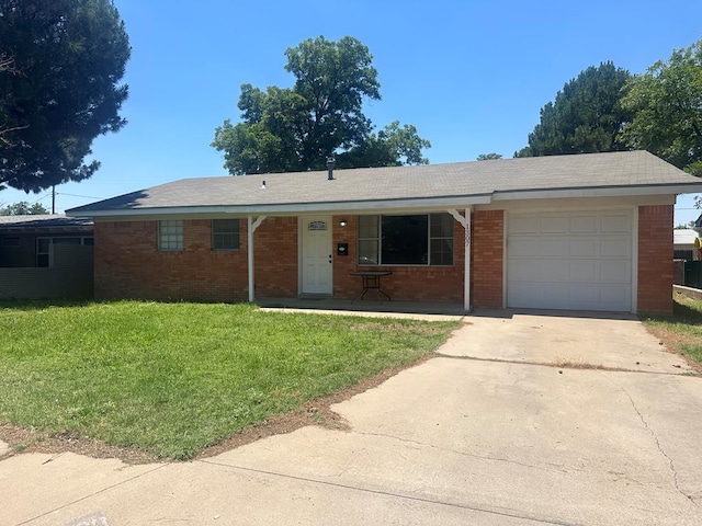 ranch-style home featuring an attached garage, a front lawn, concrete driveway, and brick siding