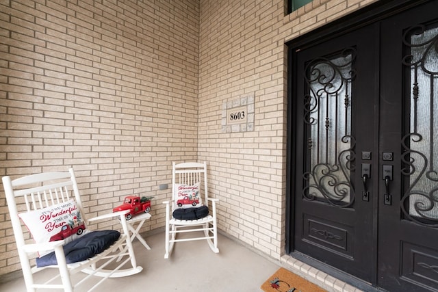 view of exterior entry featuring french doors