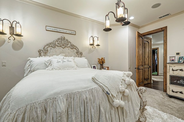 bedroom with crown molding and wood-type flooring