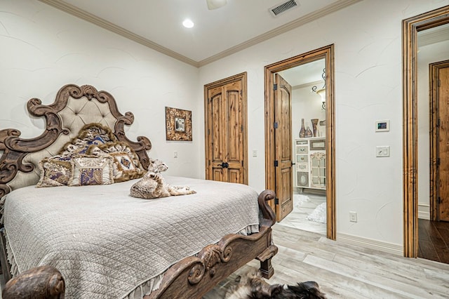 bedroom with ceiling fan, light hardwood / wood-style floors, and crown molding