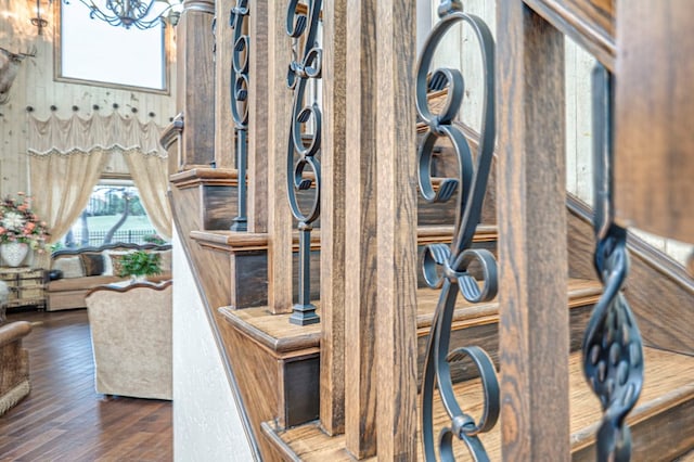 room details featuring hardwood / wood-style floors and an inviting chandelier