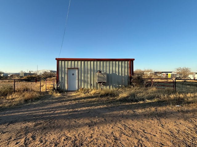 view of outbuilding with a rural view