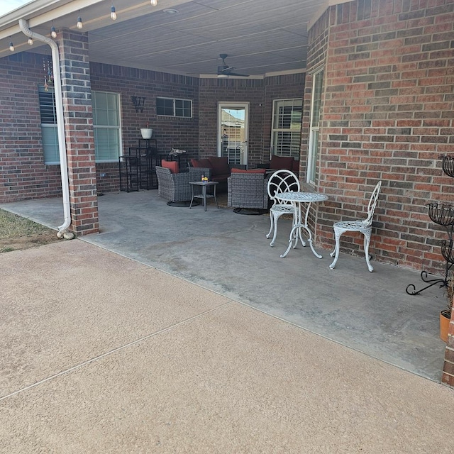 view of patio featuring an outdoor hangout area and ceiling fan