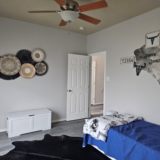 bedroom featuring dark hardwood / wood-style floors and ceiling fan