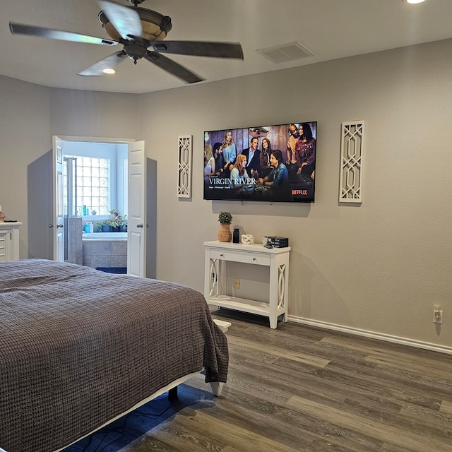 bedroom with ceiling fan and dark hardwood / wood-style floors