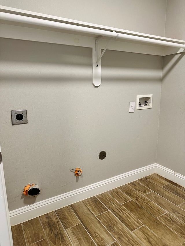 washroom featuring hookup for a gas dryer, hookup for a washing machine, hookup for an electric dryer, and hardwood / wood-style flooring