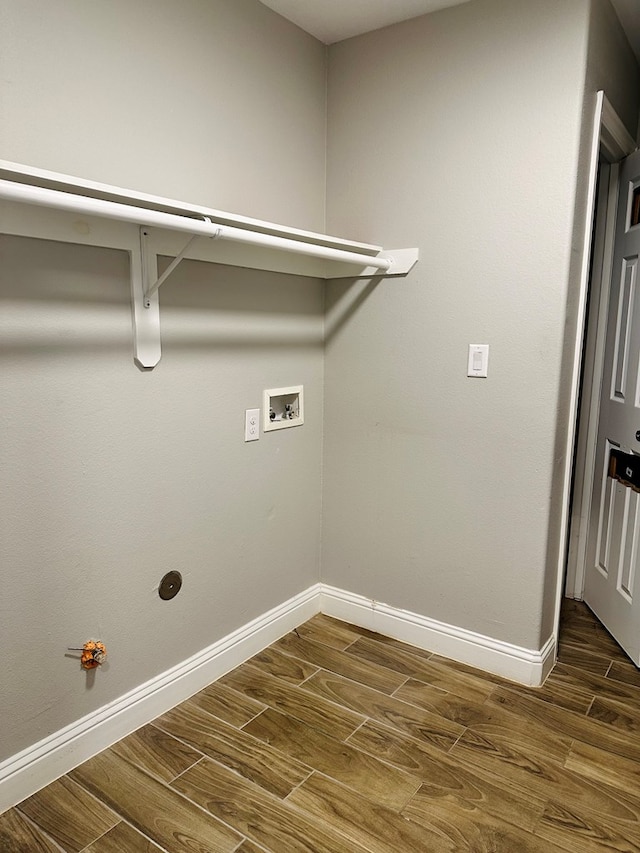 laundry area with hookup for a gas dryer, washer hookup, and dark hardwood / wood-style floors