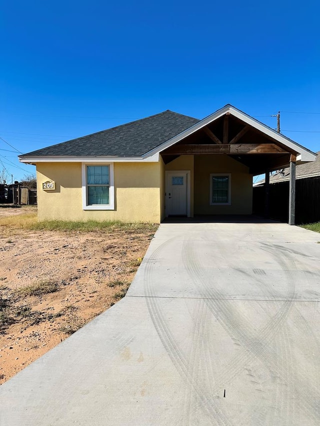 single story home with a carport