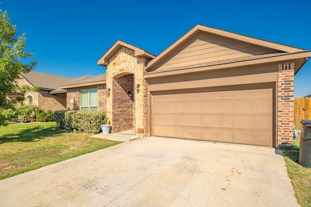 ranch-style house with a front yard and a garage