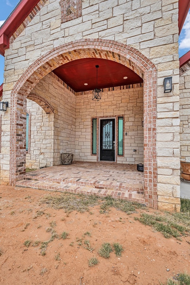 doorway to property featuring a patio area