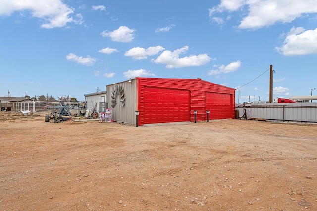 view of outbuilding with a garage