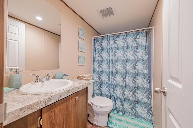 bathroom featuring vanity, curtained shower, crown molding, and toilet