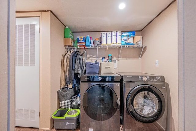 washroom featuring hardwood / wood-style floors and independent washer and dryer