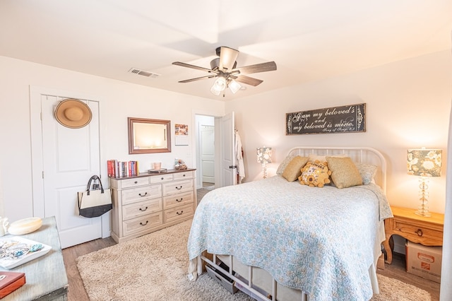 bedroom with ceiling fan and light wood-type flooring