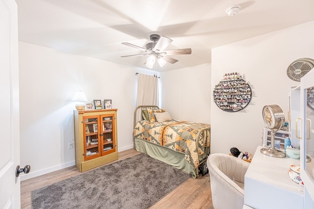 bedroom featuring ceiling fan and light hardwood / wood-style floors