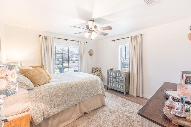 bedroom featuring wood-type flooring and ceiling fan