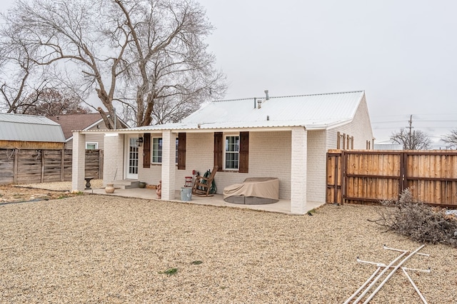 rear view of house featuring a patio