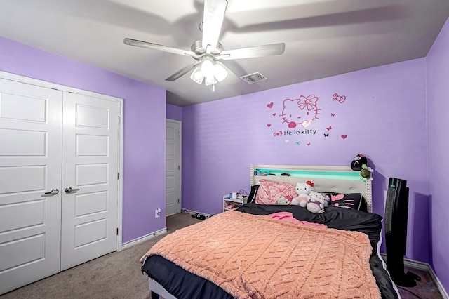 carpeted bedroom featuring a closet and ceiling fan