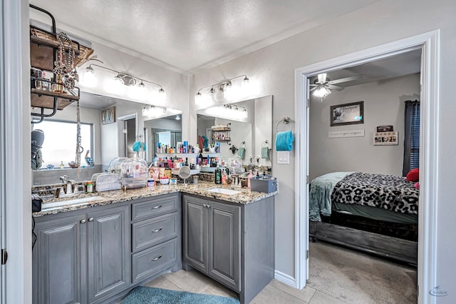 bathroom featuring vanity, tile patterned floors, and ceiling fan