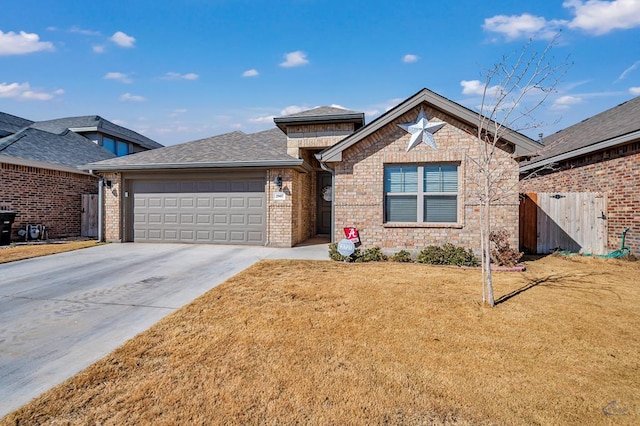 view of front of home with a garage and a front lawn