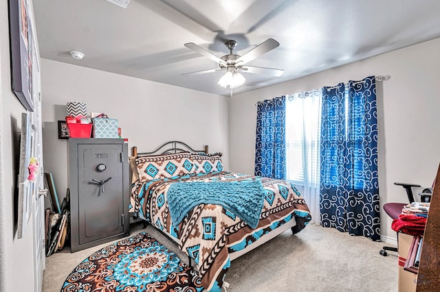 bedroom featuring ceiling fan and light carpet