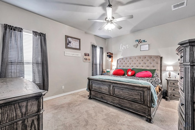 bedroom featuring light carpet and ceiling fan