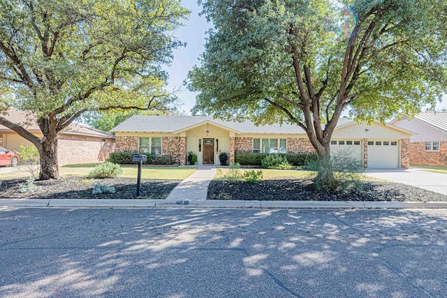 single story home featuring a garage