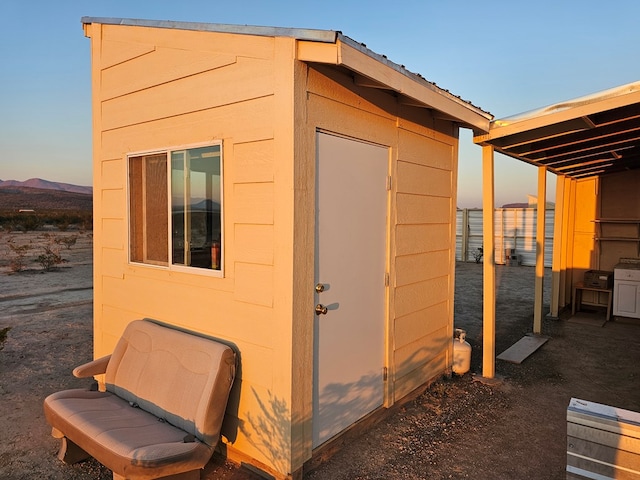 view of outdoor structure at dusk