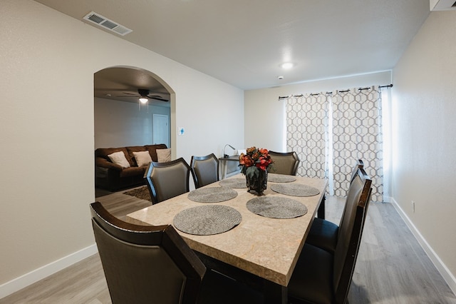 dining area featuring ceiling fan and light hardwood / wood-style flooring