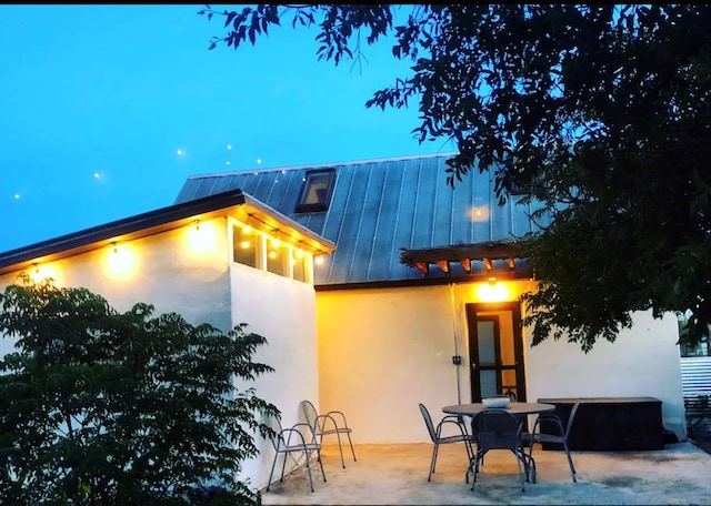 rear view of property featuring a patio area