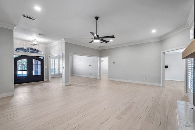 unfurnished living room with french doors, ornamental molding, ceiling fan with notable chandelier, and light hardwood / wood-style flooring